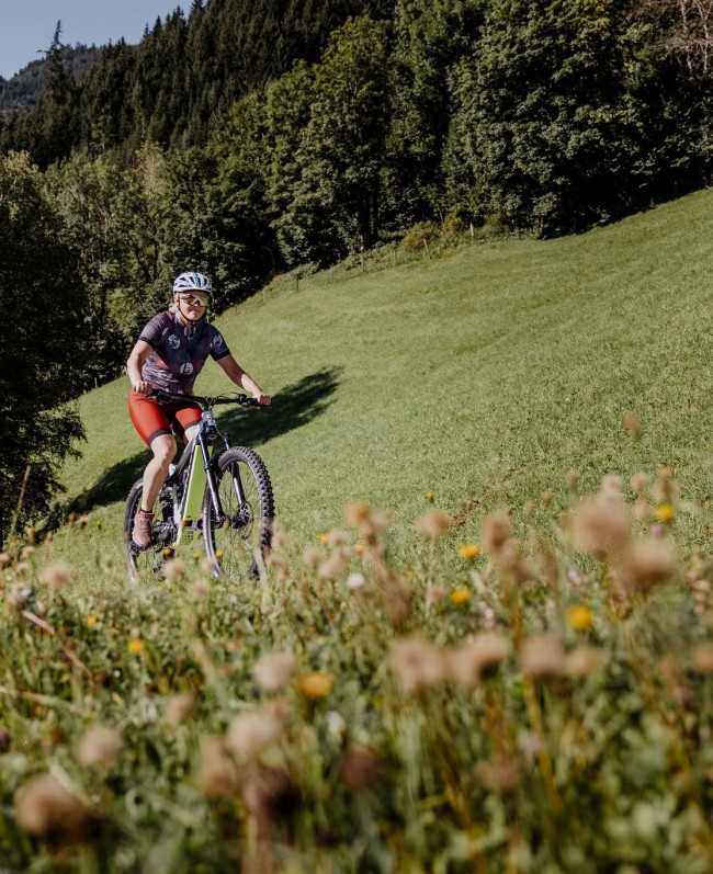 Female cyclist taking advantage of the wide range of bike routes in Grossarl
