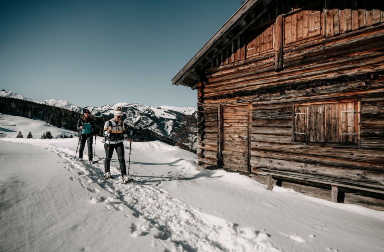 Snowshoe hike through the snowy mountains in Grossarl Valley